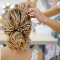 hair being styled with a plait and messy bun