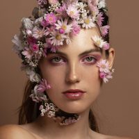 make up and hair style with flowers around face
